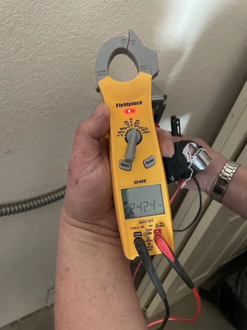 Voltage testing with clamp meter during Generator Installation in Harrison
